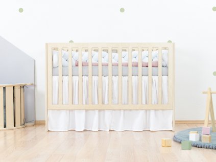 Ruffled bed skirt for a baby cot mattress in the size of 60 cm x 120 cm